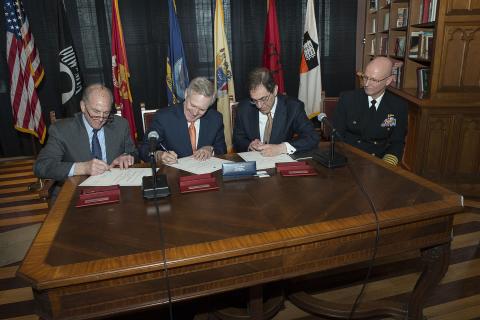 PRINCETON, N.J. (April 15, 2014) Secretary of the Navy (SECNAV) Ray Mabus, second from left, President of Rutgers University Robert Barchi, left, and President of Princeton University Christopher Eisgruber sign an agreement bringing Navy ROTC back to Princeton University, as Capt. Philip Roos, commanding officer of Rutgers Navy ROTC looks on. (U.S. Navy photo by Mass Communication Specialist 1st Class Arif Patani/Released)